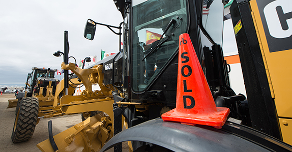 A Caterpillar motor grader is sold at a Ritchie Bros. equipment auction. A Caterpillar motor grader is sold at a Ritchie Bros. equipment auction.